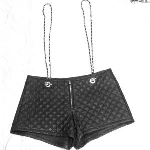 Quilted faux leather shorts with chain suspenders